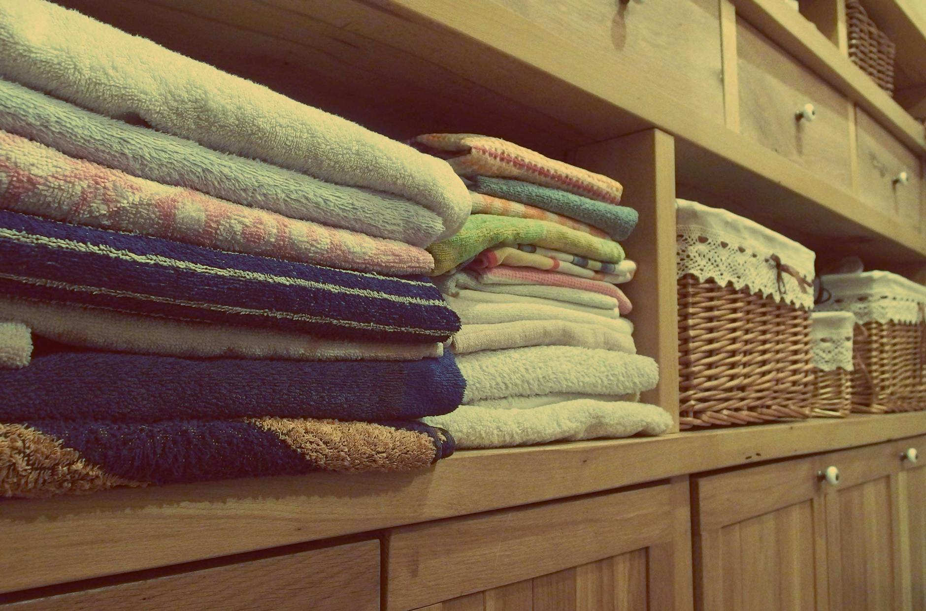 Shelves of linens neatly stacked.